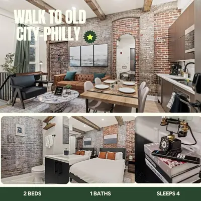 a kitchen and a living room with a brick wall at New Townhouse Sleep 4 Old City Walk to Everything! in Philadelphia