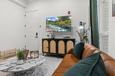 a living room with a couch and a table at In The Center of Old City Philly- Walker Paradise! in Philadelphia
