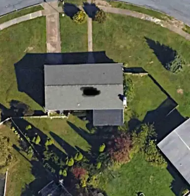 an aerial view of a building in a field at Joyful 5-Bedroom Home in Harrisburg