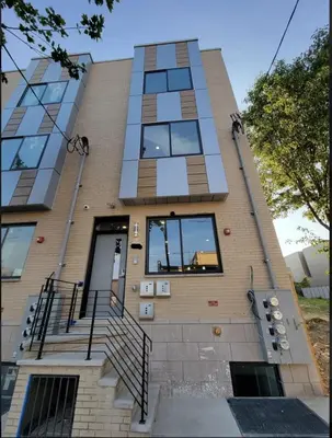 a building with stairs and windows on it at Spacious 3-Bed3BathKing BedsTVWasherDryer in Philadelphia