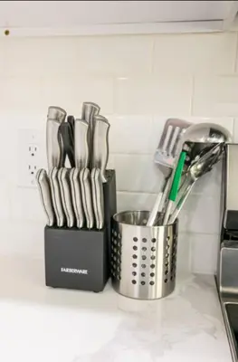 a kitchen counter with a container of utensils at Central 1BR1BAKing BedWiFiWD in Philadelphia