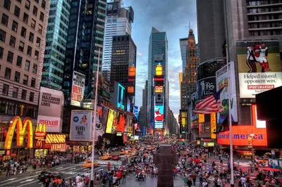 a busy city street with a crowd of people at 7 guests NYC-NWK Free parking in Newark