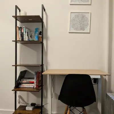 a desk with a chair next to a book shelf at Apartment near Times Square Manhattan New York in New York