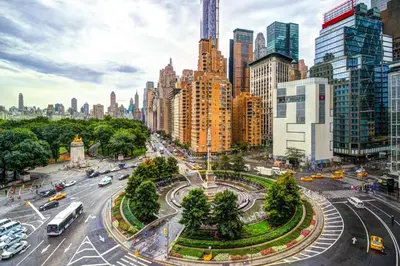 a city street with traffic in a city with tall buildings at Apartment near Times Square Manhattan New York in New York