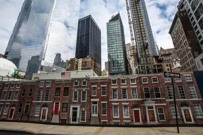 a red brick building in a city with tall buildings at Blueground Financial District rooftop nr Brooklyn Bridge NYC-1971 in New York