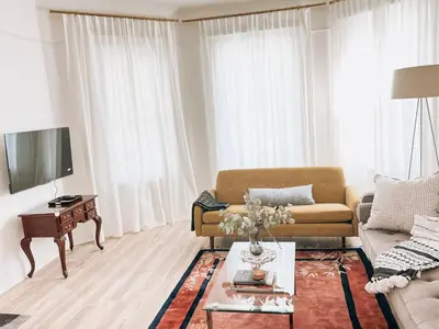 a living room with a couch and a table at Garden Oasis 3BR 23min NYC PATH in Harrison