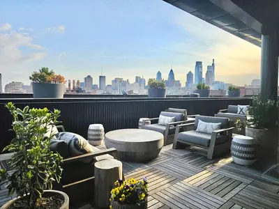 a rooftop patio with a view of a city at Studio Apt with City View, Rooftop and Gym in Philadelphia
