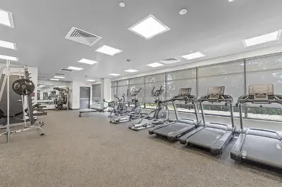 a gym with rows of treadmills and machines at Central Philly 1Br Apt with Gym in Philadelphia