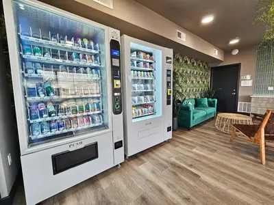 a refrigerator filled with drinks in a store at Studio Apt with Skyline Views, King Bed, and Gym in Philadelphia