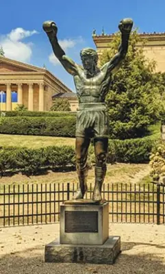 a statue of a man with his arms in the air at Quaint and Stylish APT with King Bed for Long Term Stay in Philadelphia