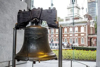 a large bell is on display in a city at Studio Apt Near Temple Unit with Free Parking for Extended Stays in Philadelphia