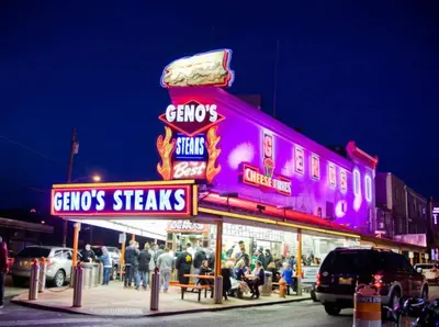 a group of people standing outside of a fast food restaurant at Chic Apartment with King Bed in Old City in Philadelphia