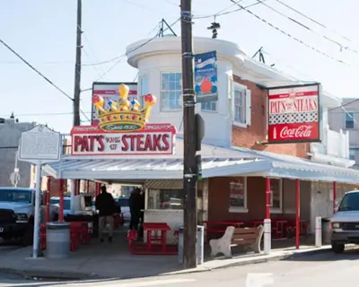 a fast food restaurant with a crown sign on a street at Chic Apartment with King Bed in Old City in Philadelphia