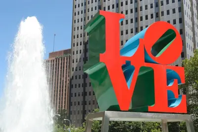 a large red exit sign in front of a fountain at Downtown Philly 1BR with Stunning Views in Philadelphia
