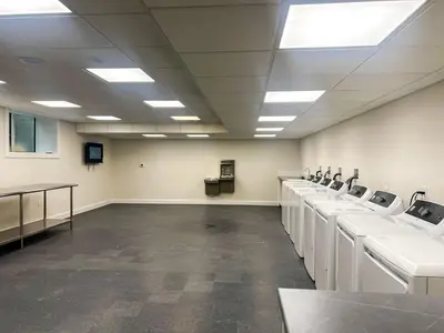 a large room with a row of sinks at 401 Modern Brand New Studio Apartment in Old Bridge
