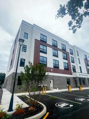 a building with a street light in front of it at 401 Modern Brand New Studio Apartment in Old Bridge