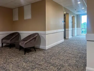a waiting room in a hospital with two chairs at 412 Modern Brand New Studio Apartment in Old Bridge