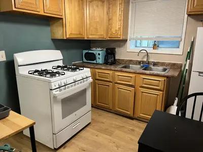 a kitchen with a stove and a sink at PR near Lourdes and UHS Hospital in Johnson City
