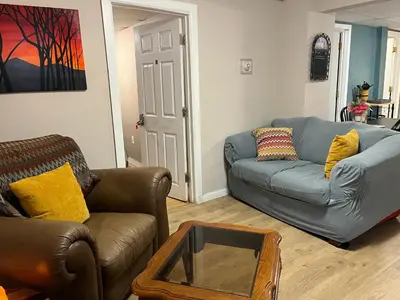 a living room with two couches and a coffee table at PR near Lourdes and UHS Hospital in Johnson City