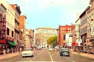 a city street with cars driving down the street at Relaxing, Calming PR by Binghamton University in Johnson City