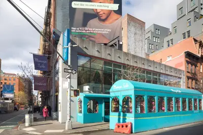 a blue building with a billboard on the side of it at Blueground Nolita private entrance nr Bowery NYC-2054 in New York