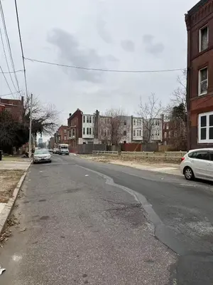 an empty street with cars parked on the side of the road at 2131 queen room With shared Bathroom in Philadelphia