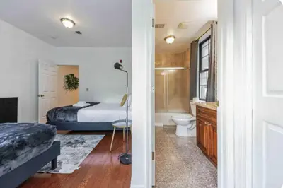 a bedroom with a bed and a bathroom with a toilet at Across from Convention Center 4F - Sleeps 6 - 4F in Philadelphia