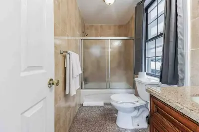 a bathroom with a shower and a toilet and a sink at Across from Convention Center 4F - Sleeps 6 - 4F in Philadelphia