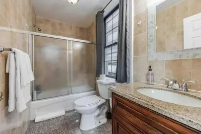 a bathroom with a toilet and a sink and a shower at Across from Convention Center - Sleeps 6 - 3F in Philadelphia