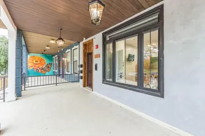 an empty hallway of a building with windows at Bi-Level 2BR w Rooftop - Sleeps 12 - 10 min to DT in Philadelphia