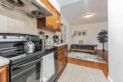a kitchen with a stove and a sink at Studio Across the Street from Convention Center 2R in Philadelphia