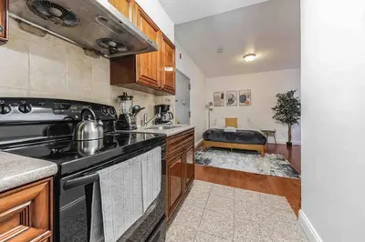 a kitchen with a stove and a sink at Studio Across the Street from Convention Center 2R in Philadelphia