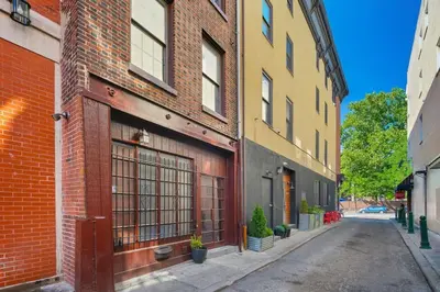 an empty street in an alley between buildings at Spacious Family Home in Philadelphia in Philadelphia