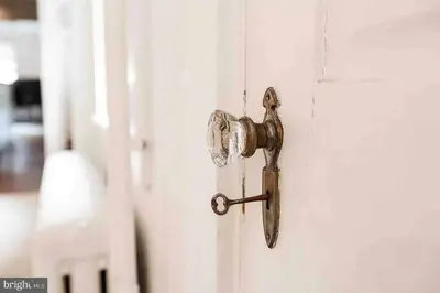 an open door with a rusty door knob at THE LEMON TREE - DOWNTOWN HISTORIC LANCASTER in Lancaster