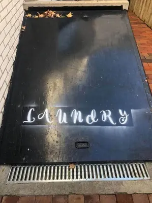 a sign that says a market on a sidewalk at THE STEVENS STUDIO - HISTORIC DOWNTOWN LANCASTER in Lancaster