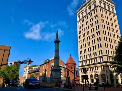 a monument in the middle of a city with buildings at THE HAMILTON HOUSE - DOWNTOWN COLONIAL LANCASTER in Lancaster