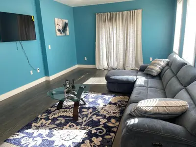 a living room with a couch and a table at Peace Haven Stay in Newark