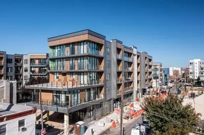 an apartment building in a city with buildings at Bright Studio Haven - Pool, Gym & Balcony Views in Philadelphia