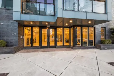 a building with large glass doors in a building at Sleek 1BR Hideaway - Gym, Pool Balcony in Philadelphia