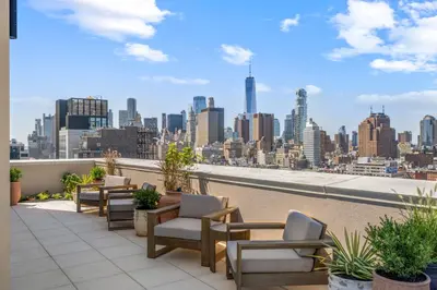 a balcony with chairs and a view of the city at Freeman 701 by Rove Travel - Studio with Shared Amenities in New York
