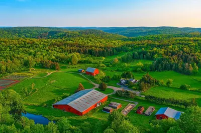 an aerial view of a farm with a barn at Country Escape Close to Ski Resort in Pleasant Mount