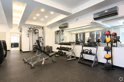 a gym with treadmills and machines in a room at Modern 1BR Escape - Balcony Gym Wi-Fi in Philadelphia