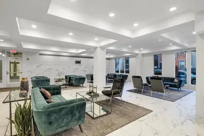a lobby with couches and chairs in a building at Modern 1BR Escape - Balcony Gym Wi-Fi in Philadelphia