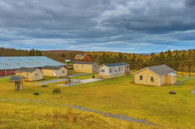 an aerial view of a farm with houses and trees at Country Escape near Camps & Ski in Pleasant Mount