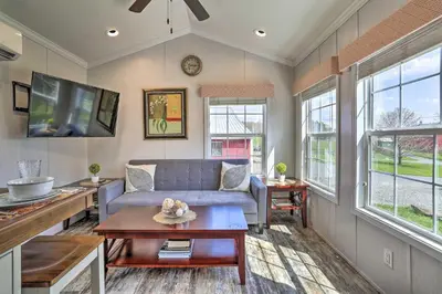 a living room with a couch and a tv at Suite to Unwind Close to Skiing in Pleasant Mount
