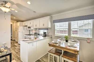a kitchen with white cabinets and a counter top at Premium Cottages and Suites near Ski Resort in Pleasant Mount