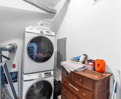 a washing machine and a washer in a room at Bright 2-Bed Loft in Northern Liberties Walk to Dining, Museums in Philadelphia