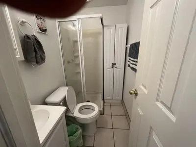 a small bathroom with a toilet and a shower at Soothing, Comfy P-Room by Wilson Memorial in Johnson City