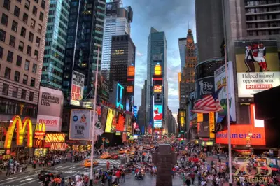 a busy city street with a crowd of people at Gorgeous and Fully Equipped Luxury 1 Bedroom Apt in New York