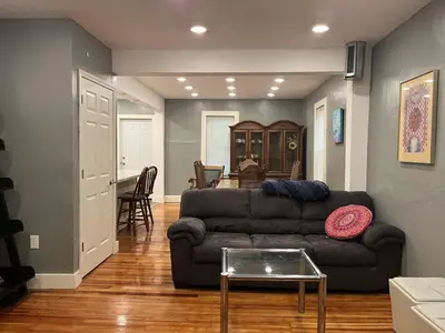 a living room with a couch and a table at Pleasant, Comfortable PR Near Vestal NY in Johnson City